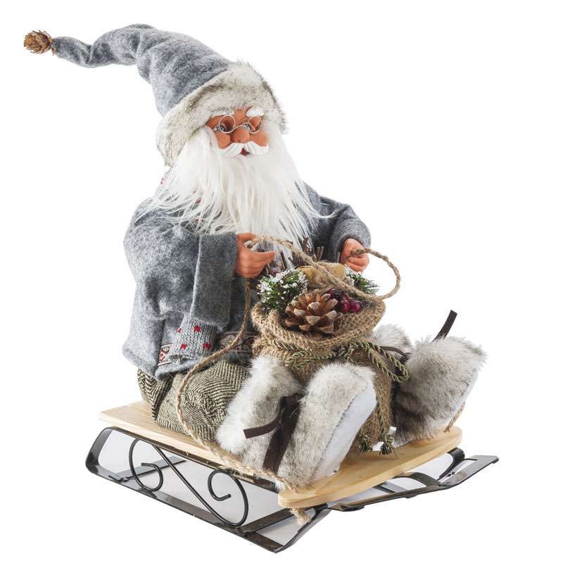 Père Noël musical gris assis sur sa luge